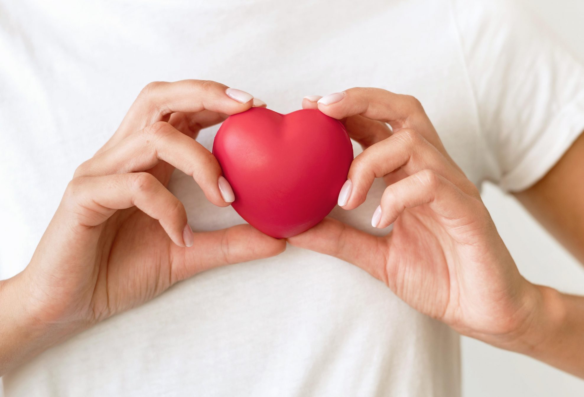 front-view-woman-holding-heart-shape