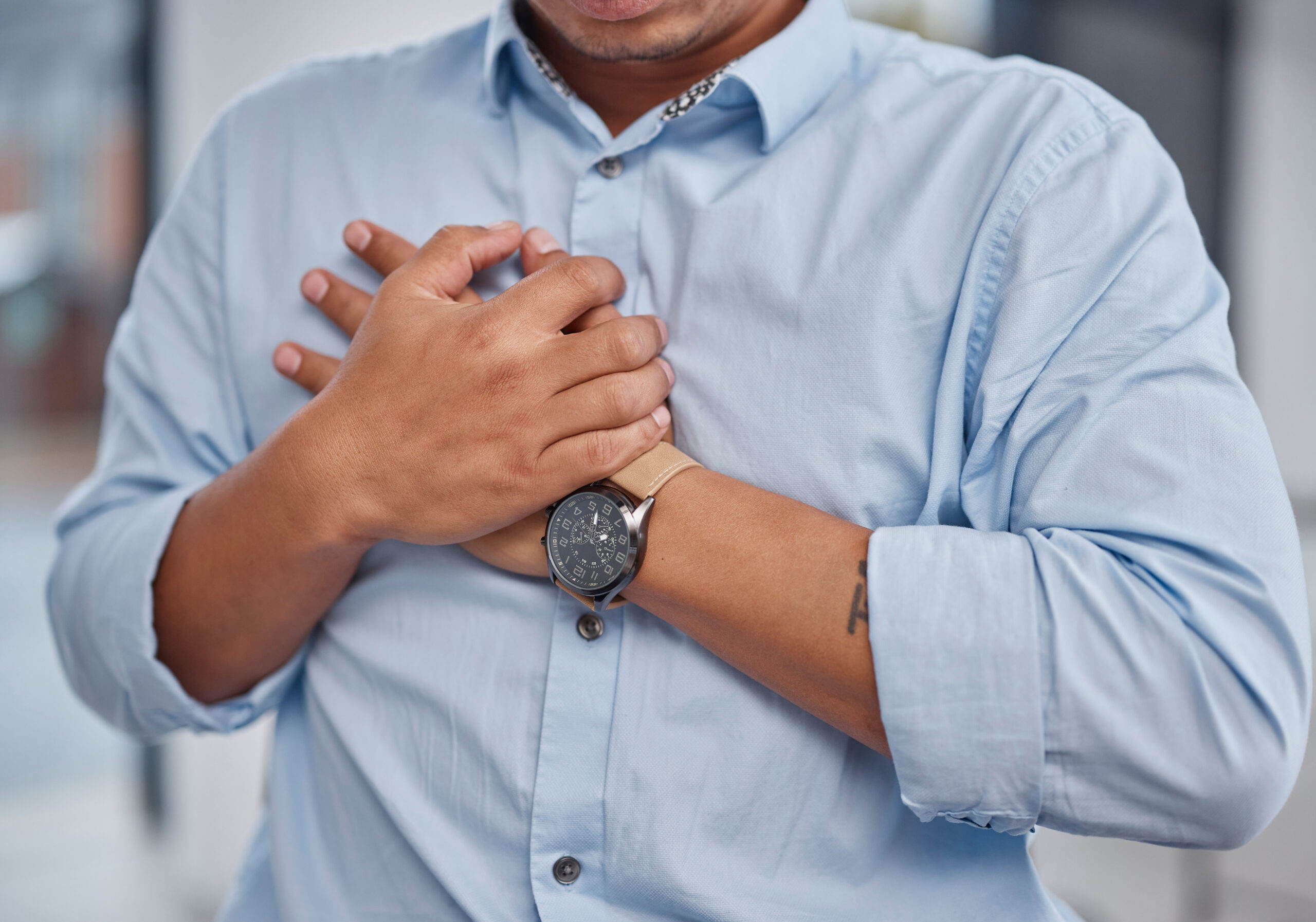 heart-attack-pain-and-man-holding-chest-in-a-offi-2023-11-27-05-23-56-utc