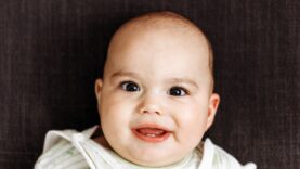 sweet-smiling-baby-with-big-eyes-and-chubby-cheeks-2024-10-17-08-39-30-utc