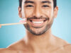 dental-portrait-and-asian-man-with-a-toothbrush-2023-11-27-04-56-45-utc