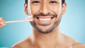 dental-portrait-and-asian-man-with-a-toothbrush-2023-11-27-04-56-45-utc