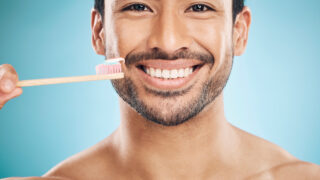 dental-portrait-and-asian-man-with-a-toothbrush-2023-11-27-04-56-45-utc
