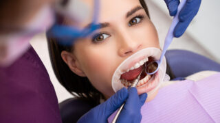 Portrait of young woman taking care of dental hygiene