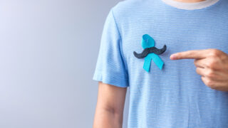 November Prostate Cancer Awareness month, Blue Ribbon with musta