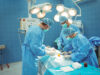 Team of surgeons performing operation in operation theater