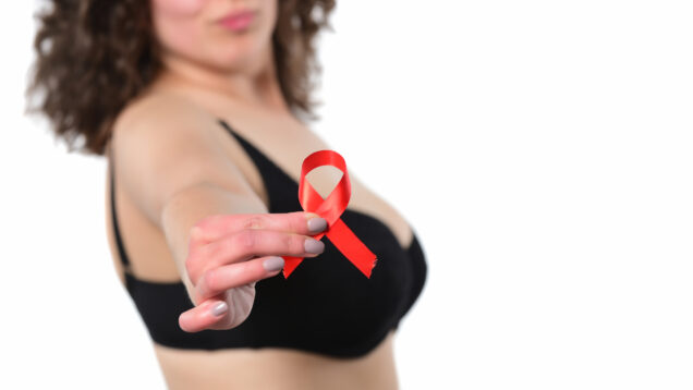 woman-s-torso-holding-red-ribbon-isolated-2026-01-11-08-59-27-utc