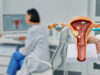 Diagnostic and medical care of gynecological disease. Gynecologist showing anatomical model uterine over gynecological consultation of woman patient with doctor