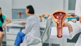 Diagnostic and medical care of gynecological disease. Gynecologist showing anatomical model uterine over gynecological consultation of woman patient with doctor
